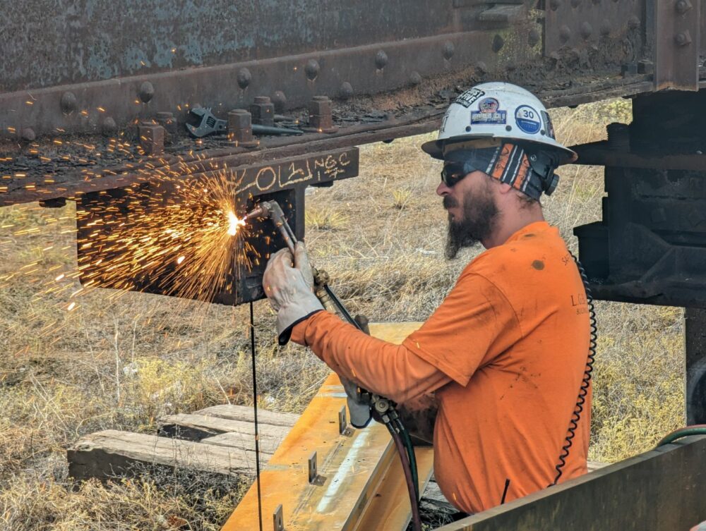 Construction worker prepping for raise.